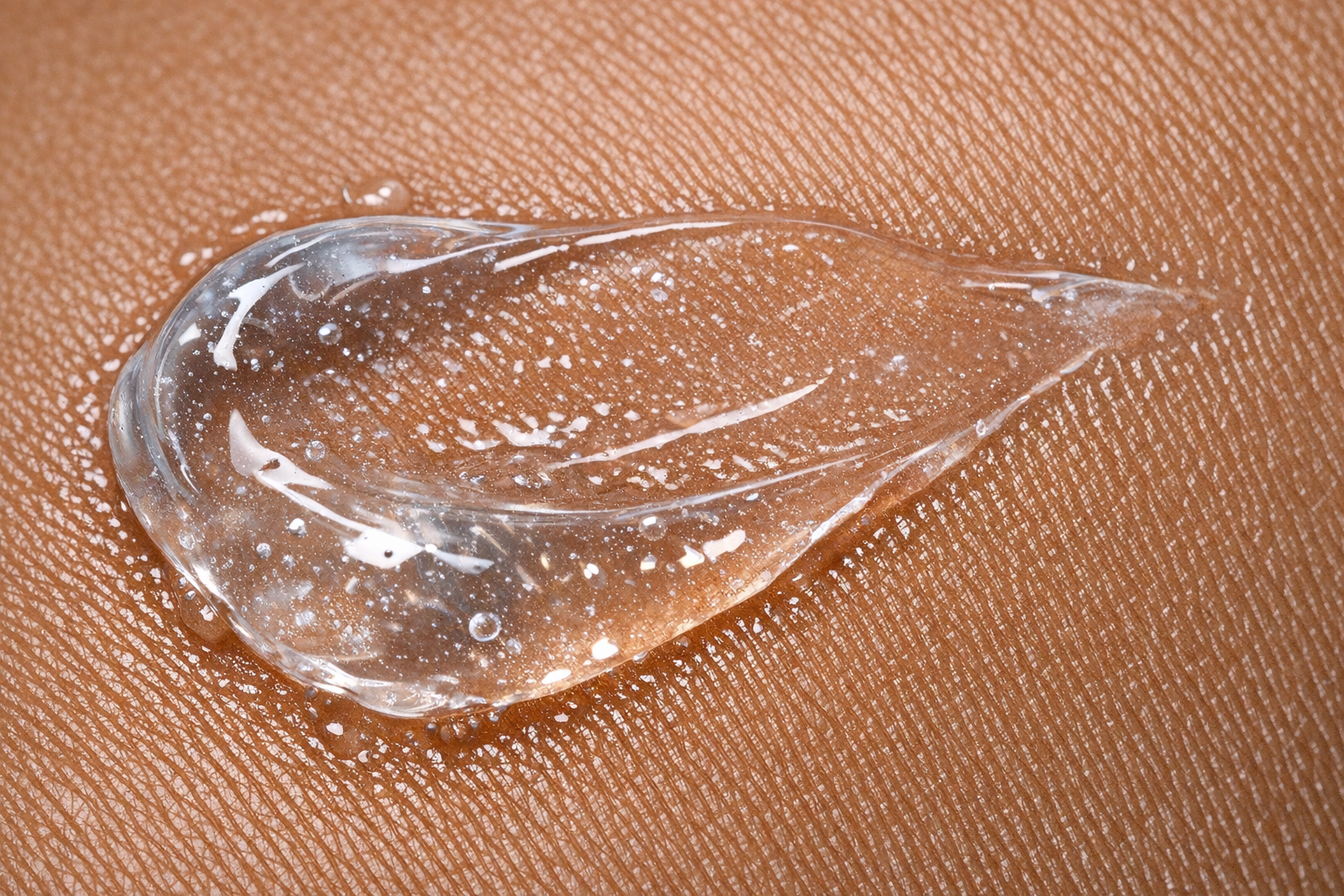 Close-up of a translucent night gel texture on brown Indian skin